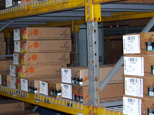 Boxed orders stacked on warehouse shelving in the SpringDot fulfillment center